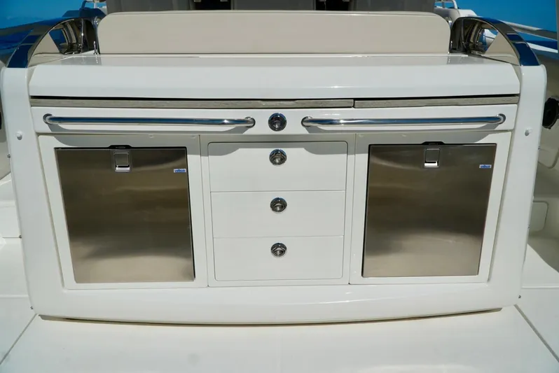  Yacht Photos Pics 2019 Boston Whaler 420 Outrage boat interior with storage compartments and drawers.