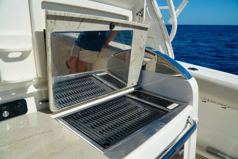  Yacht Photos Pics Outdoor grill on 2019 Boston Whaler 420 Outrage yacht, ocean view in background.