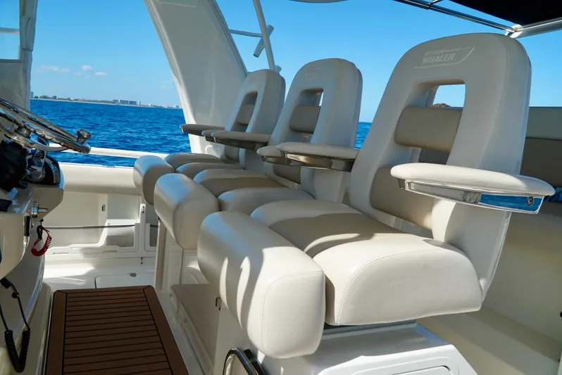  Yacht Photos Pics 2019 Boston Whaler 420 Outrage boat interior with luxurious seating and ocean view.