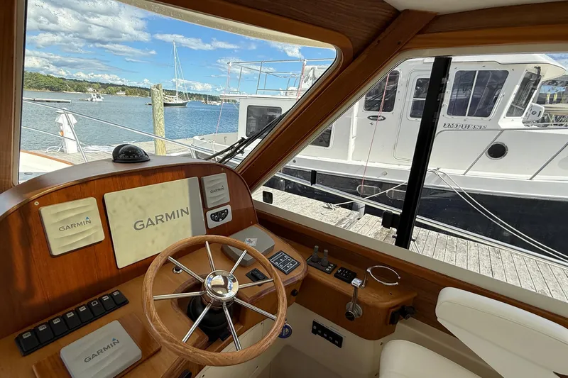 Tova Yacht Photos Pics Interior view of 2007 Legacy Yachts 32 Sedan helm with Garmin navigation system.