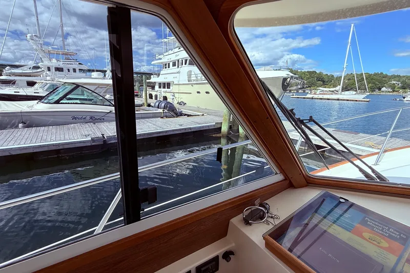 Tova Yacht Photos Pics View from 2007 Legacy Yachts 32 Sedan, overlooking marina with boats and clear sky.