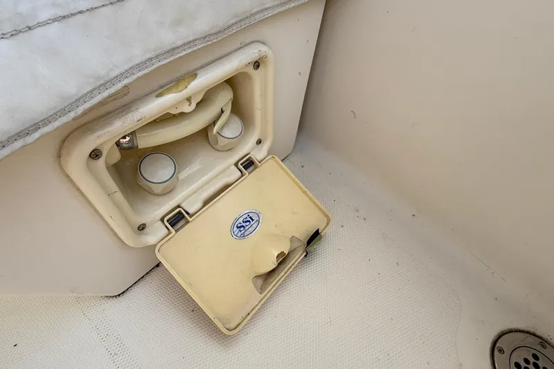 Tova Yacht Photos Pics 2007 Legacy Yachts 32 Sedan interior detail with SSI compartment and controls.