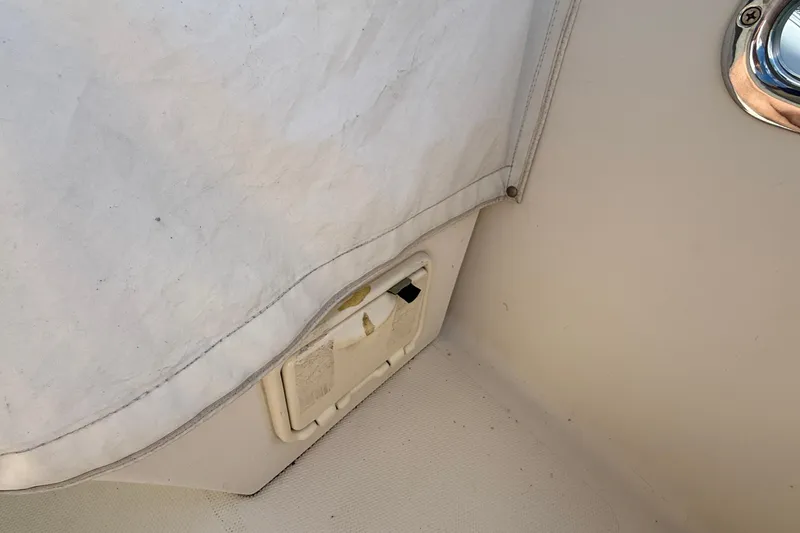 Tova Yacht Photos Pics Interior detail of a 2007 Legacy Yachts 32 Sedan, showing a covered compartment.