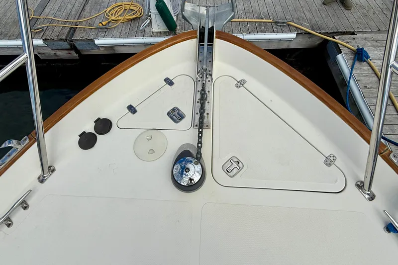 Tova Yacht Photos Pics Bow of 2007 Legacy Yachts 32 Sedan with anchor chain and deck fittings.