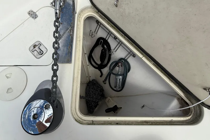 Tova Yacht Photos Pics Open anchor locker on 2007 Legacy Yachts 32 Sedan, showing chain and ropes.