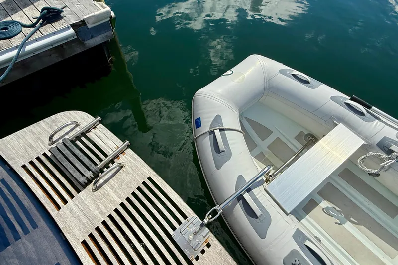 Tova Yacht Photos Pics Inflatable dinghy docked beside a 2007 Legacy Yachts 32 Sedan.