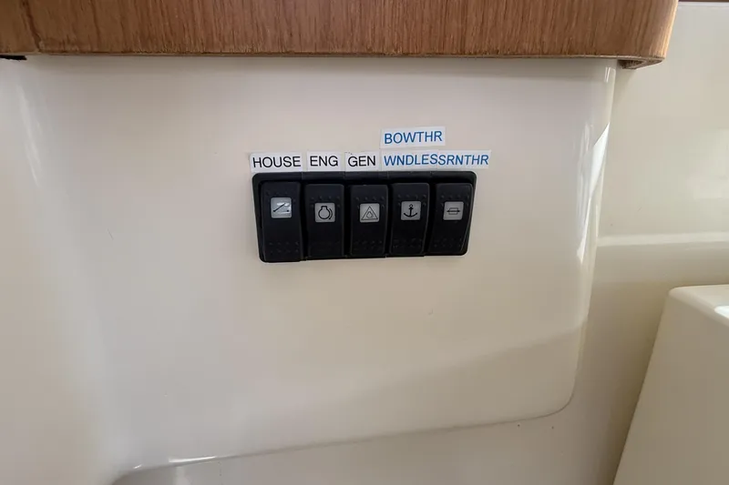 Tova Yacht Photos Pics Control panel on 2007 Legacy Yachts 32 Sedan with labeled switches.