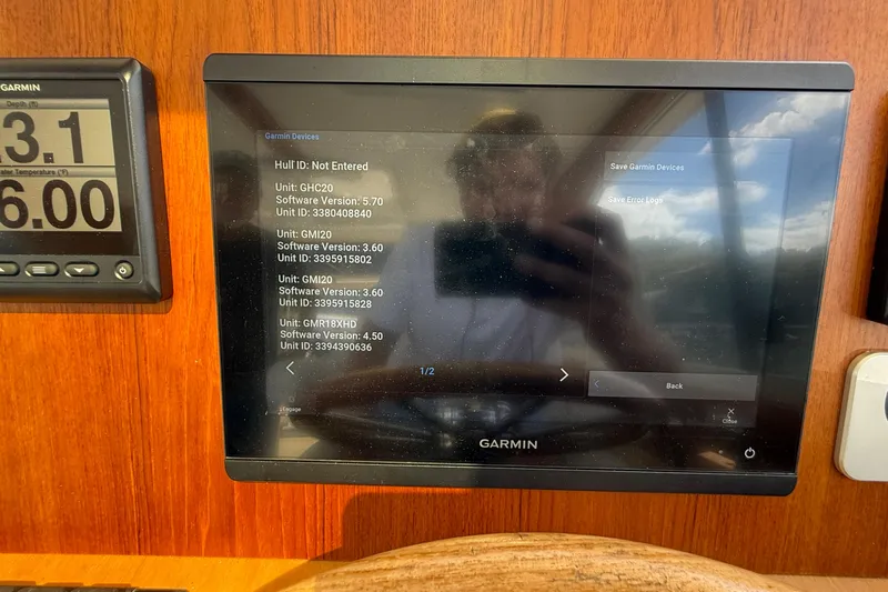 Tova Yacht Photos Pics Garmin navigation display on 2007 Legacy Yachts 32 Sedan, showing software versions and unit IDs.