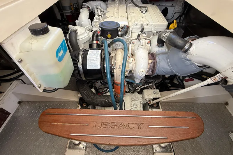 Tova Yacht Photos Pics Engine compartment of a 2007 Legacy Yachts 32 Sedan, showcasing mechanical components.