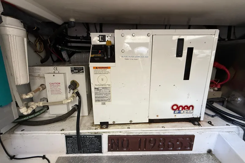 Tova Yacht Photos Pics Engine room of 2007 Legacy Yachts 32 Sedan with Onan generator and wiring.