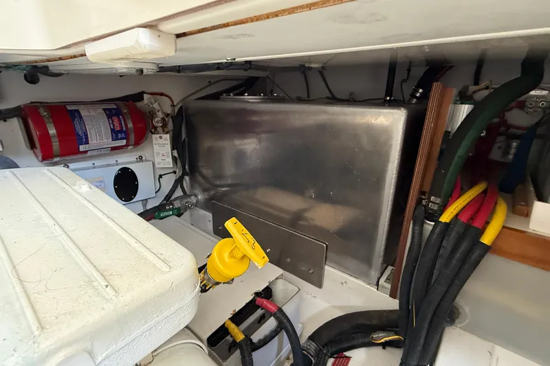Tova Yacht Photos Pics Engine compartment of 2007 Legacy Yachts 32 Sedan with fire extinguisher and wiring.
