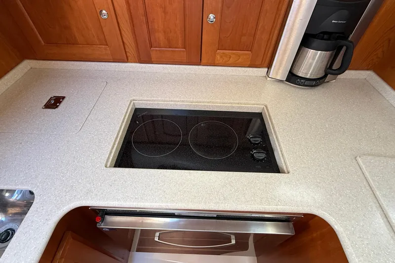 Tova Yacht Photos Pics 2007 Legacy Yachts 32 Sedan galley with stovetop and coffee maker.