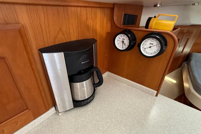 Tova Yacht Photos Pics Coffee maker and gauges in 2007 Legacy Yachts 32 Sedan interior.