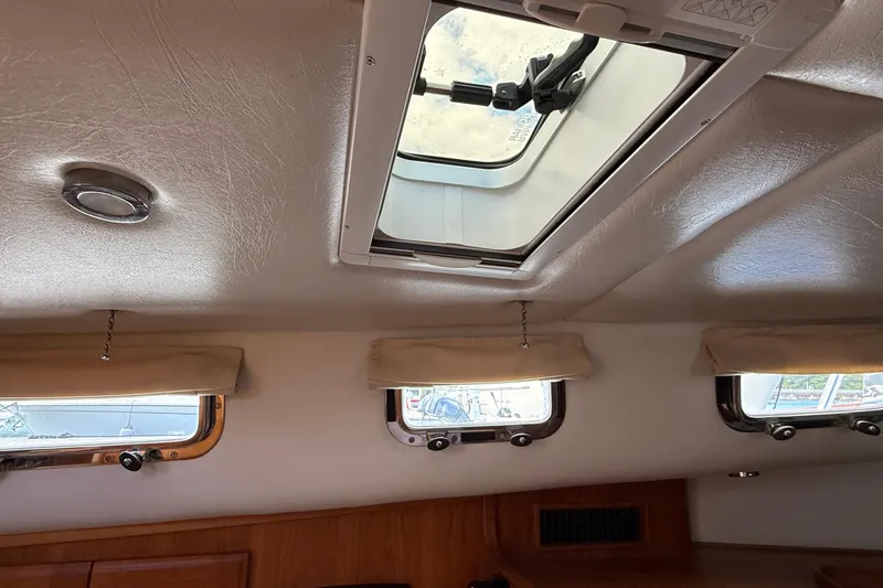 Tova Yacht Photos Pics Interior view of 2007 Legacy Yachts 32 Sedan with ceiling hatch and windows.