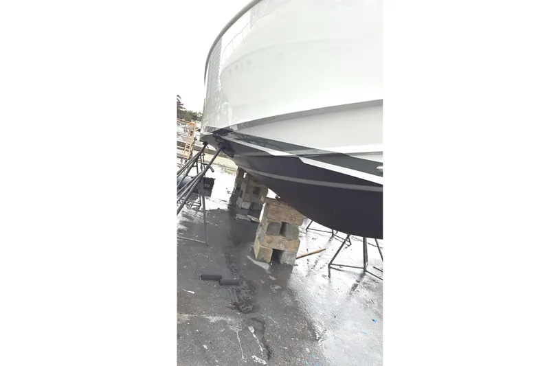 No Name Yacht Photos Pics 2019 Fjord 38 boat on blocks, hull view in a shipyard.