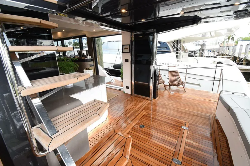 Mojo Yacht Photos Pics Luxurious 2024 OKEAN 52 yacht interior with sleek wooden flooring and modern design.
