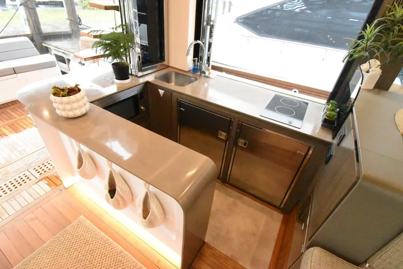 Mojo Yacht Photos Pics Modern kitchen interior on 2024 OKEAN 52 yacht with sleek countertops and appliances.