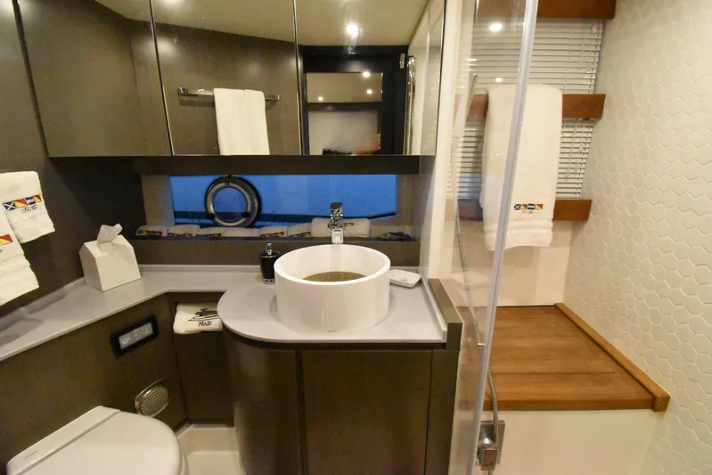 Mojo Yacht Photos Pics Luxurious bathroom in 2024 OKEAN 52 yacht with modern fixtures and elegant design.