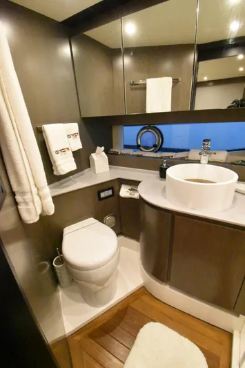 Mojo Yacht Photos Pics Luxurious bathroom in 2024 OKEAN 52 yacht with modern fixtures and elegant design.