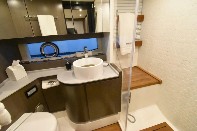 Mojo Yacht Photos Pics Luxurious bathroom in 2024 OKEAN 52 yacht with modern fixtures and elegant design.