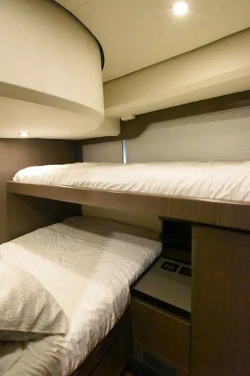 Mojo Yacht Photos Pics 2024 OKEAN 52 yacht interior with cozy bunk beds and modern design.