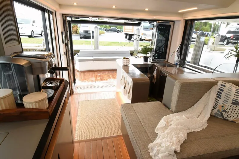 Mojo Yacht Photos Pics Luxurious interior of 2024 OKEAN 52 yacht with modern furnishings and open layout.