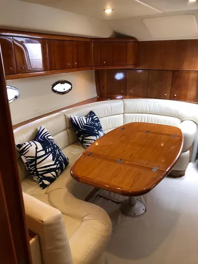 Hotan Yacht Photos Pics Luxurious Sunseeker Portofino 46 yacht interior with elegant wood and leather seating, 2003 model.