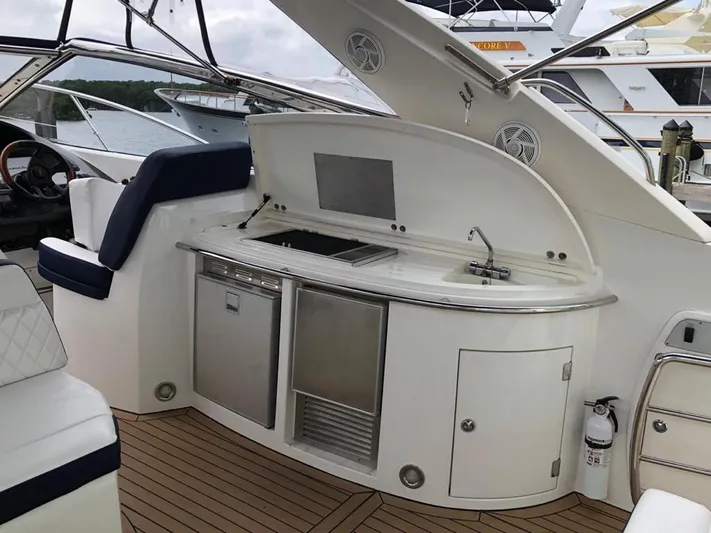 Hotan Yacht Photos Pics Luxury Sunseeker Portofino 46 yacht interior with kitchenette, 2003 model.