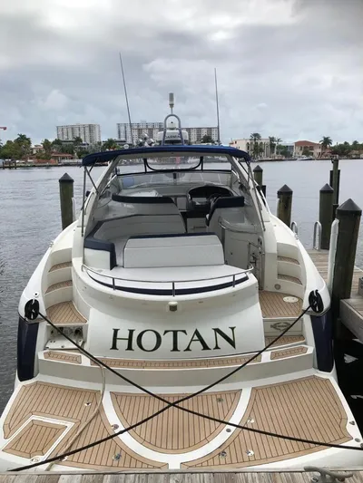 Hotan Yacht Photos Pics 2003 Sunseeker Portofino 46 yacht docked at marina, rear view.