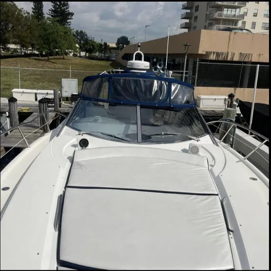 Hotan Yacht Photos Pics 2003 Sunseeker Portofino 46 yacht docked at marina, featuring sleek design and spacious deck.