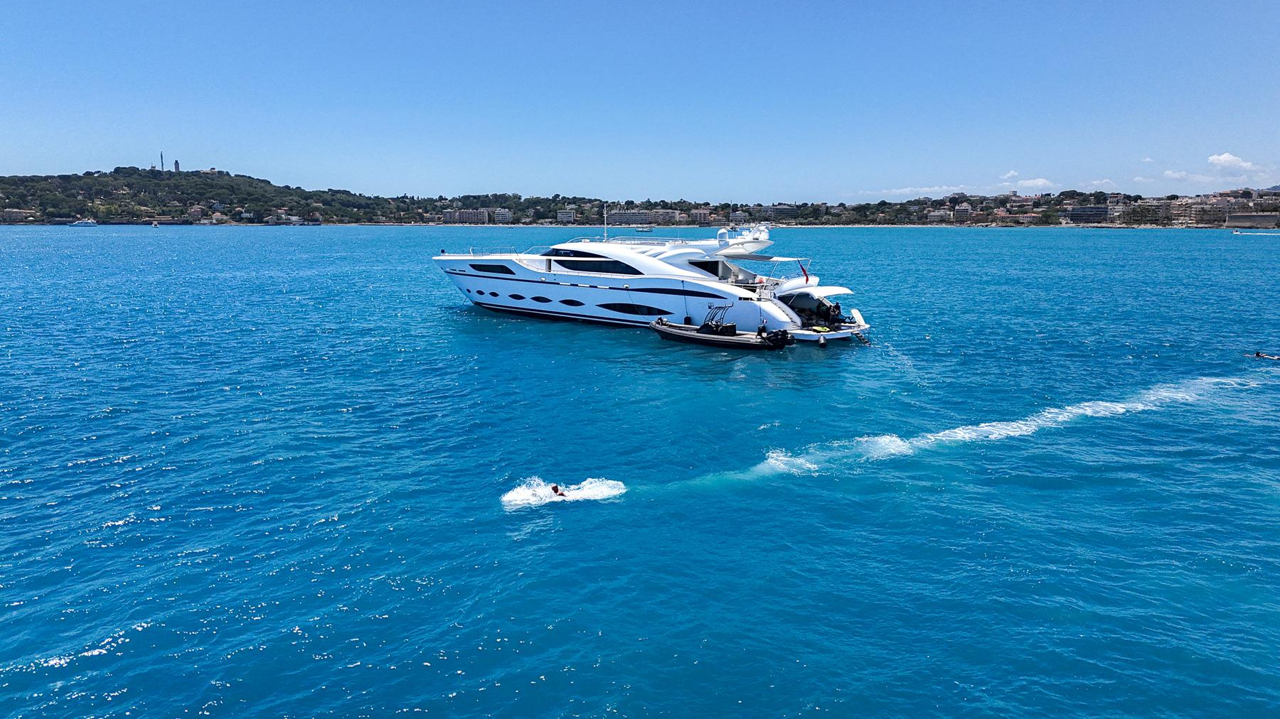 Luxurious 2016 AB Yachts model cruising on vibrant blue waters.
