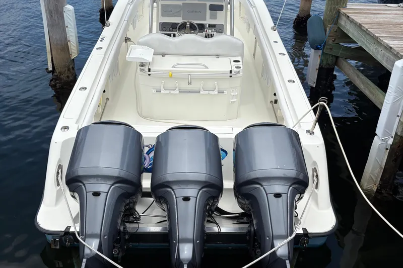 5 O'clock Somewhere Yacht Photos Pics 2007 Hydra-Sports Vector 3300 CC boat with triple outboard engines docked at marina.