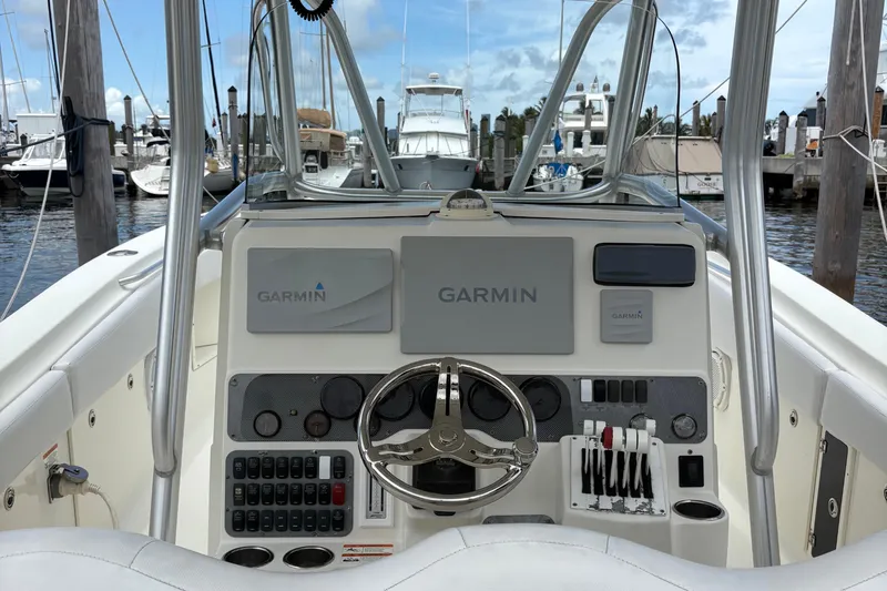 5 O'clock Somewhere Yacht Photos Pics 2007 Hydra-Sports Vector 3300 CC boat dashboard with Garmin navigation system.