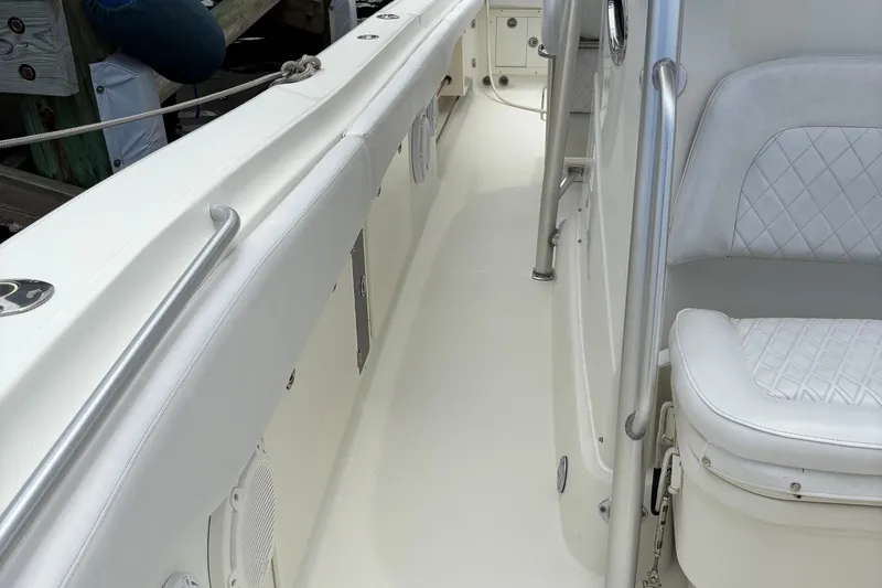 5 O'clock Somewhere Yacht Photos Pics 2007 Hydra-Sports Vector 3300 CC boat interior with white seating and stainless steel railings.