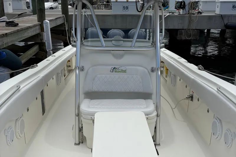 5 O'clock Somewhere Yacht Photos Pics 2007 Hydra-Sports Vector 3300 CC boat interior with seating and console at dock.