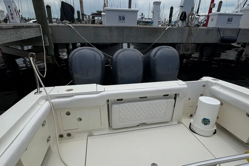 5 O'clock Somewhere Yacht Photos Pics 2007 Hydra-Sports Vector 3300 CC boat with triple engines docked at marina.