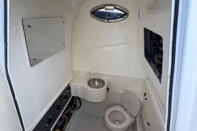 5 O'clock Somewhere Yacht Photos Pics 2007 Hydra-Sports Vector 3300 CC boat bathroom with sink and toilet.