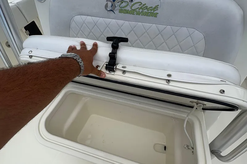 5 O'clock Somewhere Yacht Photos Pics Hand opening storage compartment on 2007 Hydra-Sports Vector 3300 CC boat.