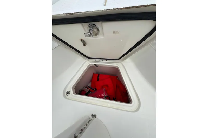 5 O'clock Somewhere Yacht Photos Pics Storage compartment on 2007 Hydra-Sports Vector 3300 CC with life jackets inside.
