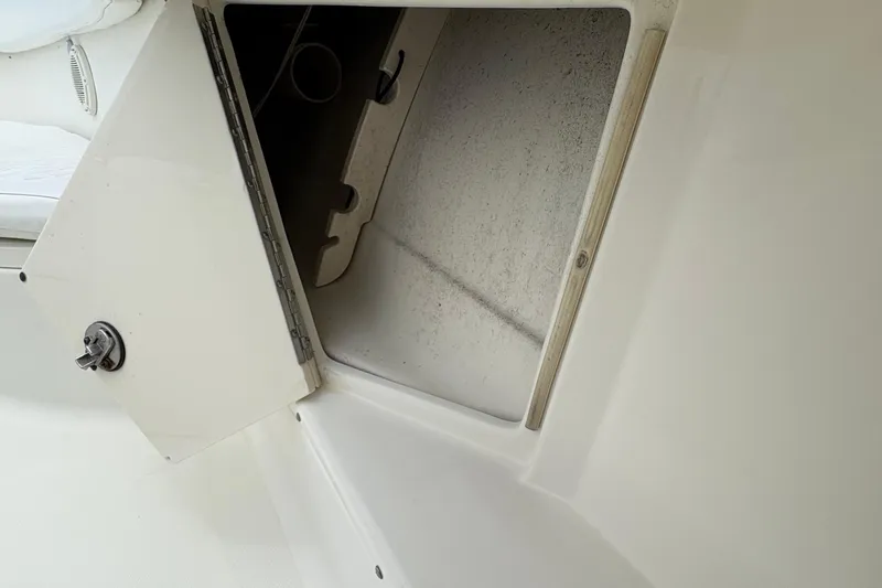 5 O'clock Somewhere Yacht Photos Pics Open storage compartment on 2007 Hydra-Sports Vector 3300 CC boat.