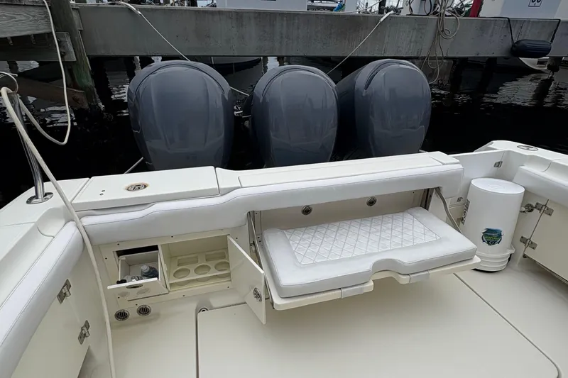 5 O'clock Somewhere Yacht Photos Pics 2007 Hydra-Sports Vector 3300 CC boat with triple engines and seating area.