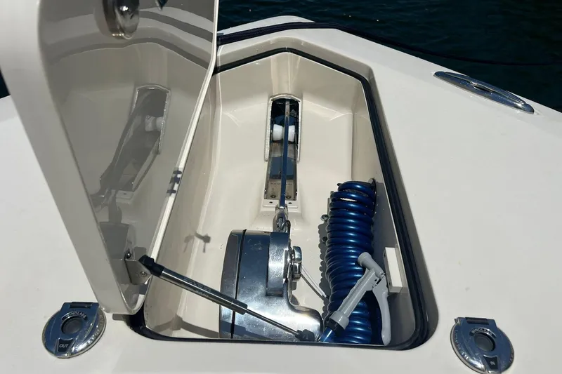  Yacht Photos Pics 2024 Scout 355 LXF anchor locker with coiled hose and anchor winch.