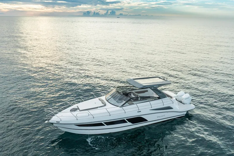  Yacht Photos Pics Valiatt 380GT 2025 luxury yacht cruising on serene ocean waters at sunset.