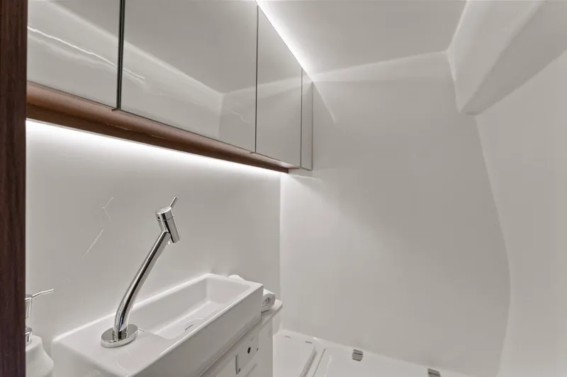  Yacht Photos Pics Modern bathroom in 2025 Valiatt 380GT with sleek sink and mirrored cabinets.