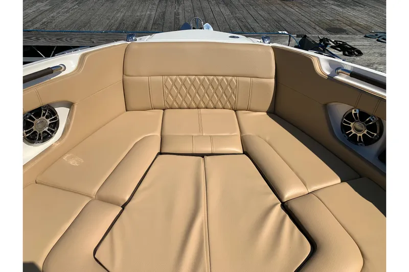  Yacht Photos Pics Luxurious tan seating on 2023 Sea Ray SLX 280 boat, featuring stylish design and speakers.