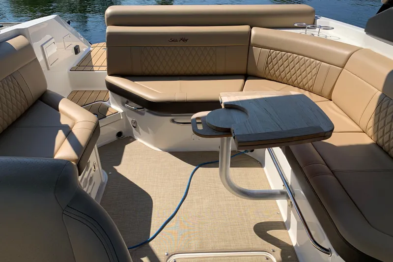  Yacht Photos Pics Luxurious seating area on 2023 Sea Ray SLX 280 boat with elegant tan upholstery.