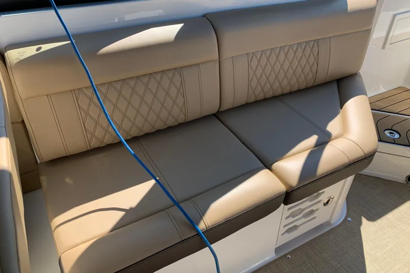  Yacht Photos Pics Luxurious tan seating on 2023 Sea Ray SLX 280 boat, featuring diamond stitching.