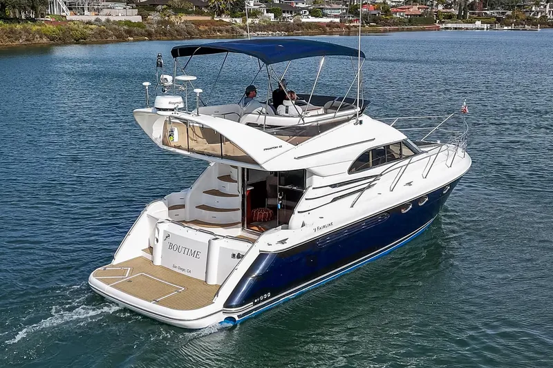 Phantom 42 Yacht Photos Pics 1998 Fairline Phantom 42 yacht cruising on a calm waterway.