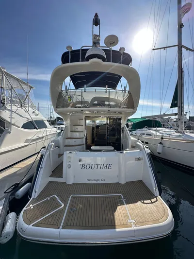 Phantom 42 Yacht Photos Pics 1998 Fairline Phantom 42 yacht docked, rear view with sunlit deck and marina background.