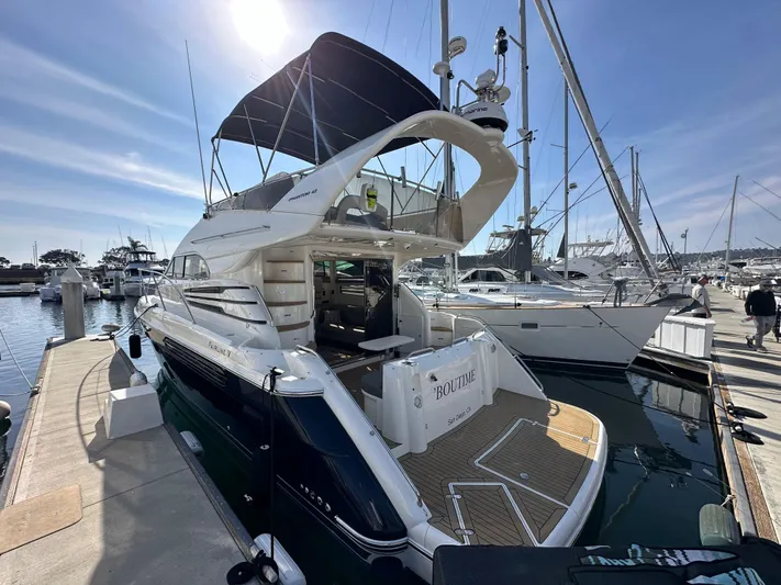 Phantom 42 Yacht Photos Pics 1998 Fairline Phantom 42 yacht docked at marina under clear sky.